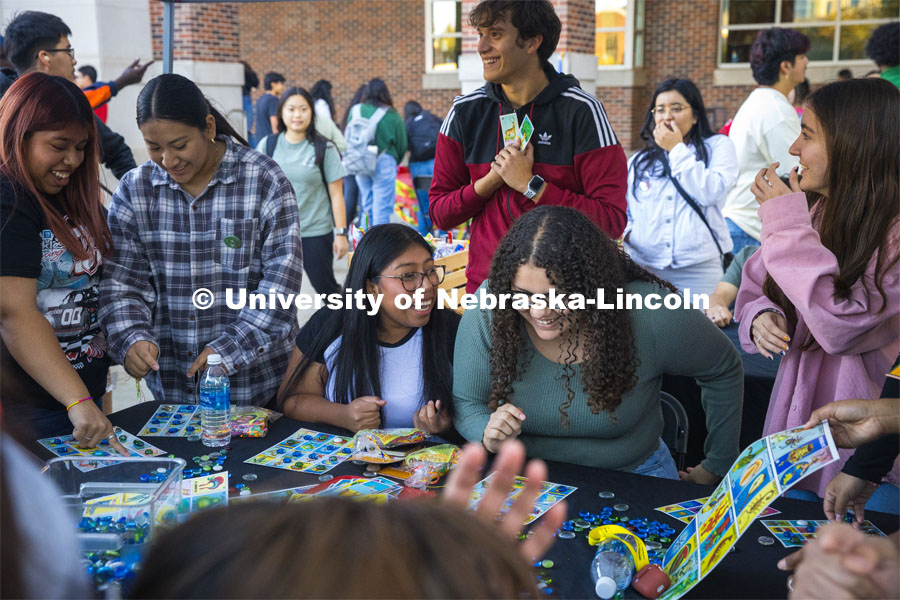 The Mexican American Student Association had an enthusiastic crowd at a large table playing Mexican Bingo. Students gathered around, waiting for their chance to try to fill a card for a prize. Fiesta on the green at the Nebraska Union Plaza. Fiesta on the Green is an annual Latino culture and heritage festival. October 5, 2023. Photo by Kristen Labadie / University Communication.